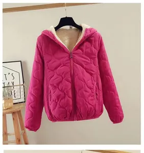 Women's magenta fleece-lined quilted hooded jacket featuring heart pattern stitching