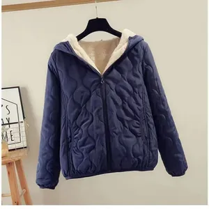 Stylish women's blue hooded quilted jacket featuring a warm white fleece lining for winter