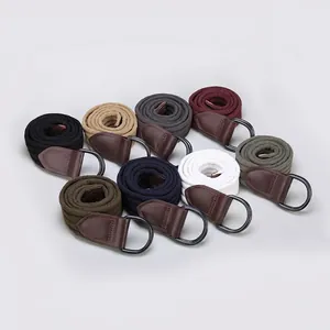 Cinturones de lona en varios colores con hebillas de doble anilla D y puntas de cuero