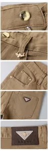 Gros plan détaillé du pantalon en jean kaki pour homme avec logo abeille doré et patch triangle