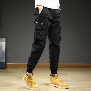 Men's Japanese style loose black cargo pants with multiple pockets for outdoor sports