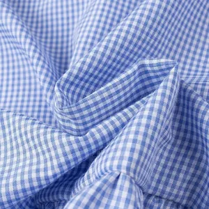 Close-up detail showing the soft blue and white gingham fabric texture for summer blouses