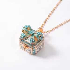 Elegant square locket pendant necklace featuring a blue enamel bow with crystal accents