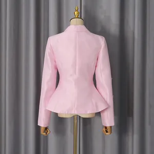 Back view of a luxury pink satin blazer with peplum waist and beaded sleeve details