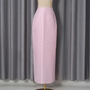 Elegant pink satin long skirt on mannequin showing sleek silhouette and fabric texture.