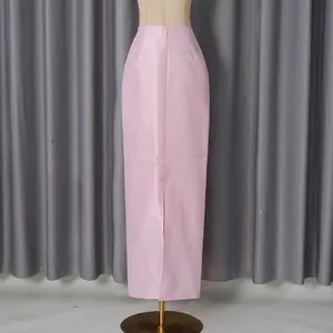 Rear view of a elegant pink satin maxi skirt with back slit and zipper detail.