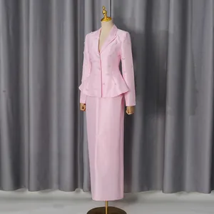 Macro view of elegant pink satin blazer and skirt set with crystal embellishments