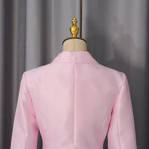 Detailed rear view showing the elegant collar and satin texture of a pink luxury blazer.