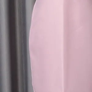 Detailed macro shot of smooth pink satin fabric texture from the blazer skirt set
