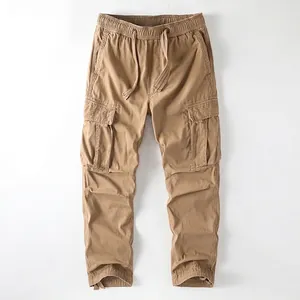 Men's khaki vintage cargo pants featuring a drawstring waist and multiple functional pockets