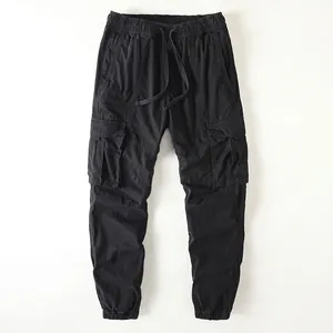 Vintage men's black cargo pants with drawstring waistband and elastic tapered cuffs
