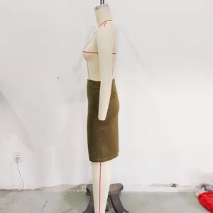 Detailed side view of an olive green suede midi skirt on a dress form mannequin