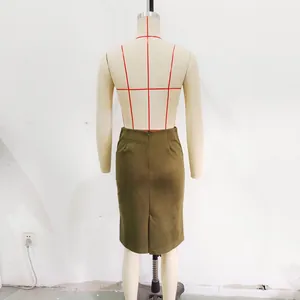Back view detail of olive green suede-textured pencil skirt with slit on a dress form