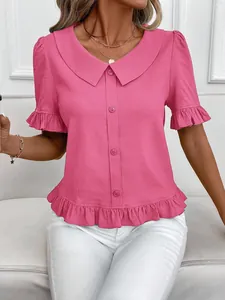 Elegant pink textured blouse featuring a Peter Pan collar and feminine ruffle details.
