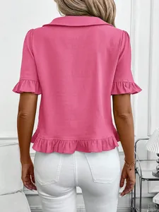 Back view of a elegant pink short-sleeved blouse featuring ruffle trim and textured fabric