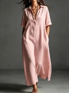 Elegant pink cotton linen short sleeve maxi shirt dress with lapel collar and side pockets.