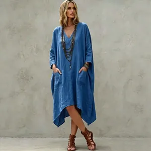 Casual boho style blue cotton linen V-neck dress featuring irregular hem and pockets