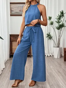Elegant summer blue halter neck crop top and wide-leg trousers two-piece set for women