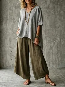 Full view of women's boho casual outfit with V-neck loose tunic and wide-leg trousers