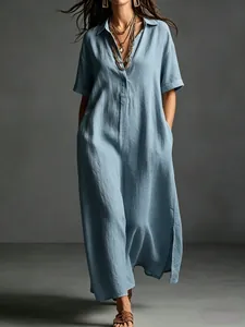 Elegant light blue cotton linen maxi dress with lapel collar and short sleeves.