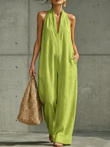 Detail view of a vibrant lime green cotton linen sleeveless jumpsuit with V-neckline