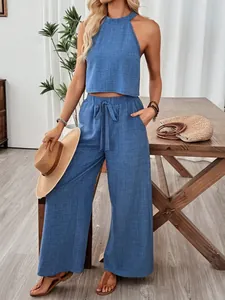 Chic two-piece blue halter sleeveless crop top and wide-leg pants set for summer leisure