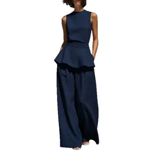 Elegante completo due pezzi blu navy in cotone e lino con top peplo e pantaloni a gamba larga