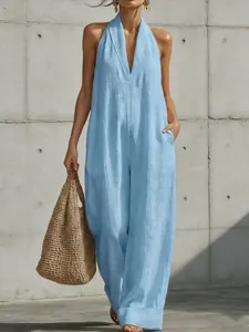 Elegant sleeveless light blue linen jumpsuit for women with halter neck and wide leg