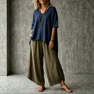 Bohemian summer outfit with loose navy V-neck tunic and olive green wide-leg pants