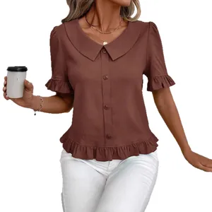 Elegant brown short sleeve blouse featuring a peter pan collar and delicate ruffle hem