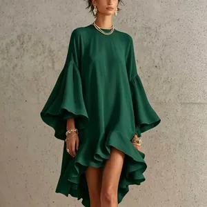 Close-up of elegant green asymmetric dress featuring large bell sleeves and ruffled high-low hem