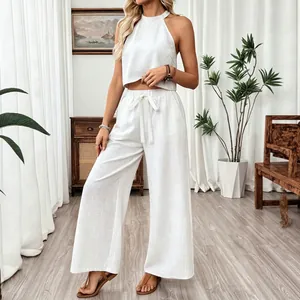 Chic white halter crop top and wide-leg trousers two-piece summer set for women
