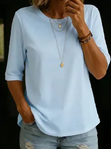 Detail view of women's light blue casual t-shirt with round neck and short sleeves.