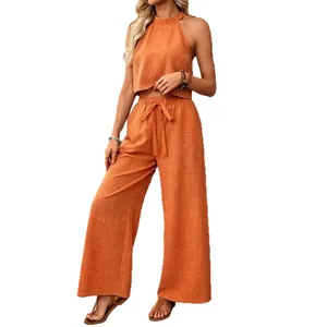 Casual summer 2-piece set featuring a halter crop top and wide-leg trousers in orange.