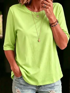 Close-up of a women's lime green casual crew neck T-shirt with stylish half sleeves.