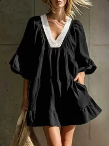 Detailed view of women's black V-neck lace dress with loose ruffles for vacation