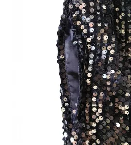 Macro detail view of silver sequins and inner pocket lining on black stage jacket