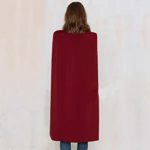 Back view of elegant wine red long cape coat for women with a minimalist silhouette