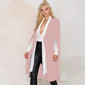 Close-up of the elegant pink longline cape coat styled with white blouse and leather pants