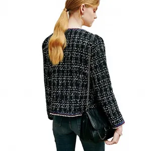 Classic black and white checkered tweed jacket for women in elegant Western style.