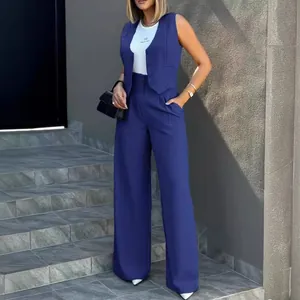 Elegant navy blue two-piece suit with tailored waistcoat and flowing wide-leg trousers