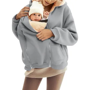 Close-up detail of a gray warm fleece hoodie featuring a baby carrier kangaroo pocket.