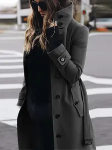 Detailed shot of women's slim fit dark grey wool coat with elegant button accents