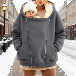 Close-up of oversized winter fleece hoodie with baby-carrying kangaroo pocket.