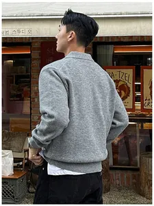 Back view of a premium men's grey knit polo sweater featuring a comfortable casual fit.