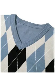 Close-up detail of the V-neck collar and blue argyle jacquard knit pattern on men's sweater