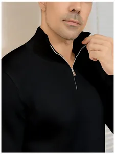 Close-up detail of a men's black quarter-zip knit sweater showing the zipper and collar.
