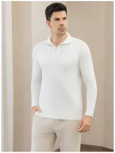 Detail view of the white quarter-zip knit sweater showing the zipper and collar design
