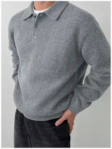 Detailed macro view of a men's grey knitted polo sweater with high-quality soft texture