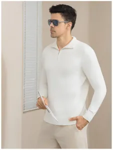 Detail of slim fit white long sleeve knit polo sweater with half-zip collar on male model